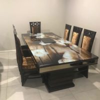 Elegant Glass Top 8-Seater Dining Table with Dark Golden Wooden Chairs.jpeg